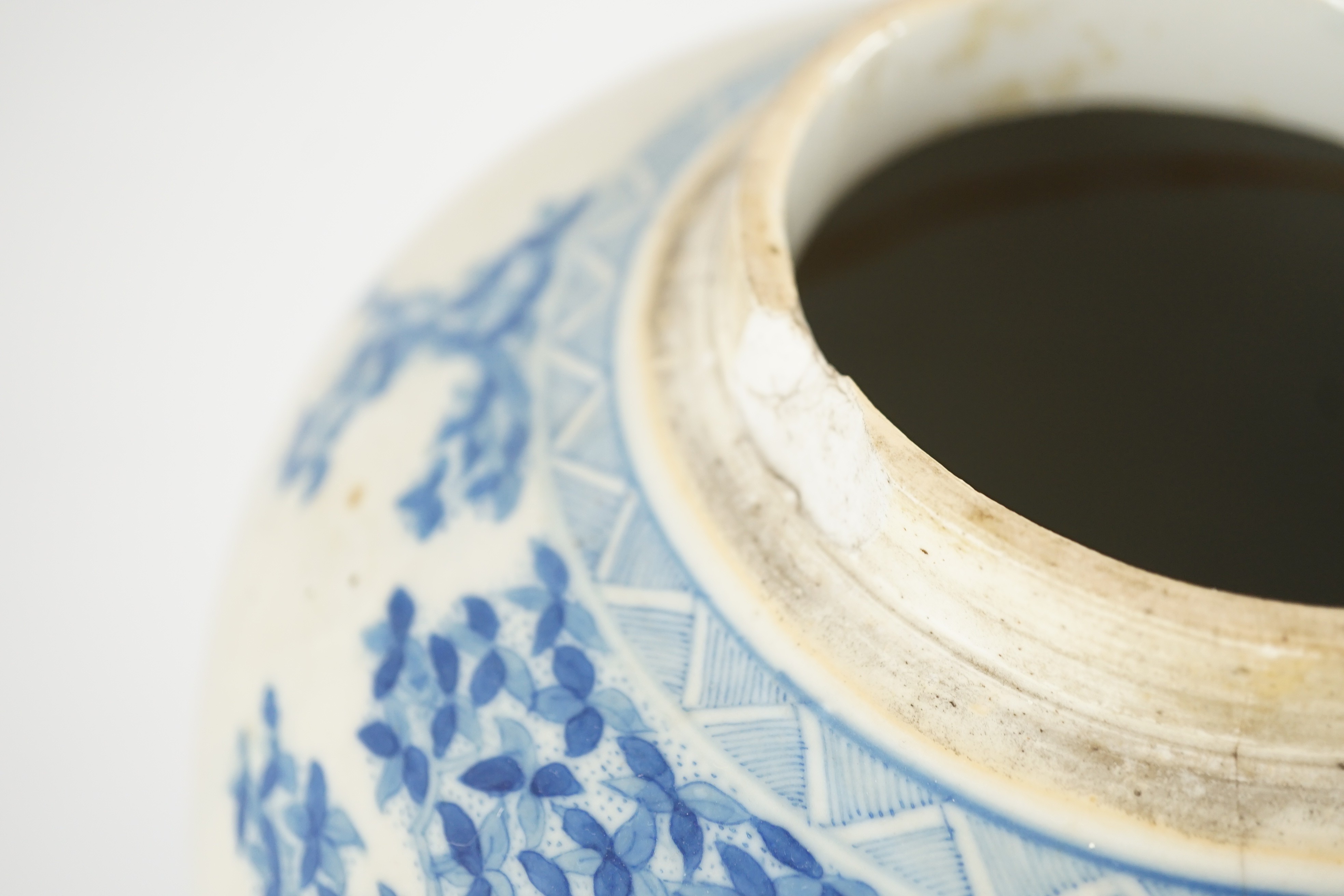 A pair of large Chinese blue and white ovoid jars and associated covers, 19th century, 34.5cm high, damage and repairs